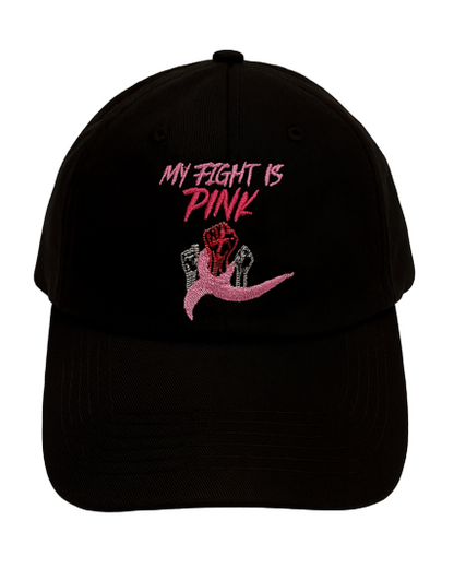 Black baseball cap with “My Fight Is Pink” embroidery and pink awareness ribbon design. Close-up of pink stitching and raised ribbon detail on the Self Inspired Apparel hat.